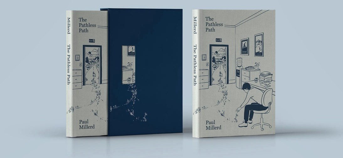 The premium hardcover beside its slipcase